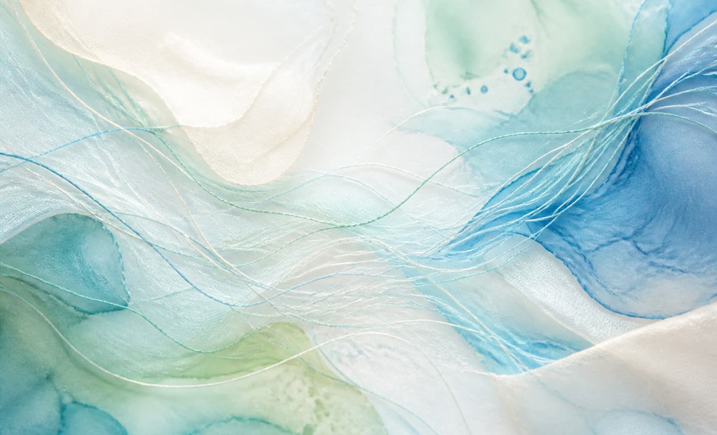 Layered blue, green and cream watercolour threads